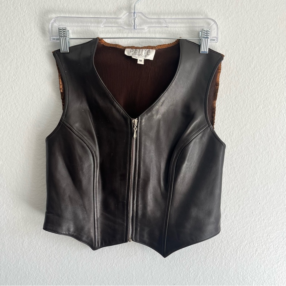 Black leather vest with brown lining and zipper detail